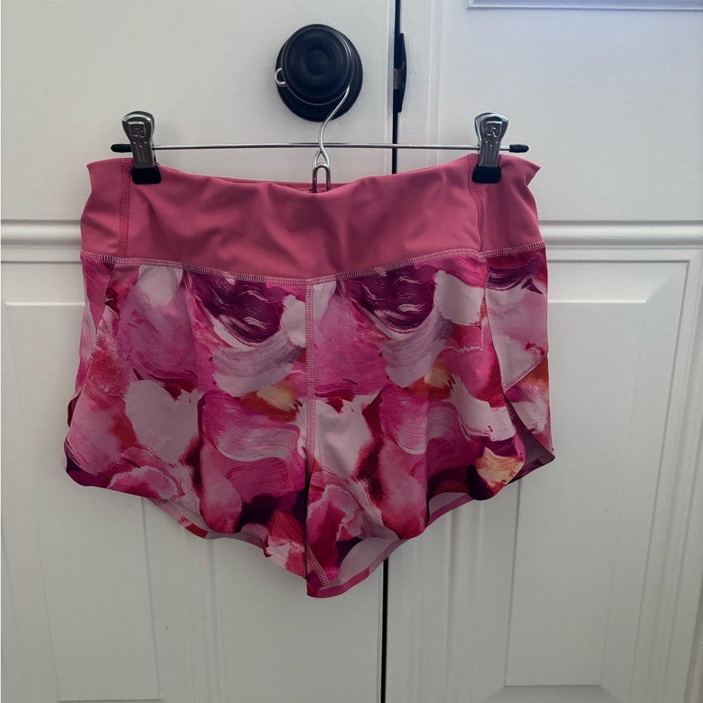 Athletes size small.  Run with it 4.5” shorts.  In pink floral pattern.